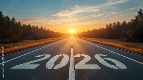 2026 New Year concept with large white numbers on empty asphalt road leading to sunrise horizon, symbolizing journey, hope, new opportunities, and future goals.