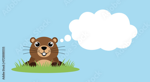 A cute groundhog peeking out from its burrow on a sunny day thinking about its next move.