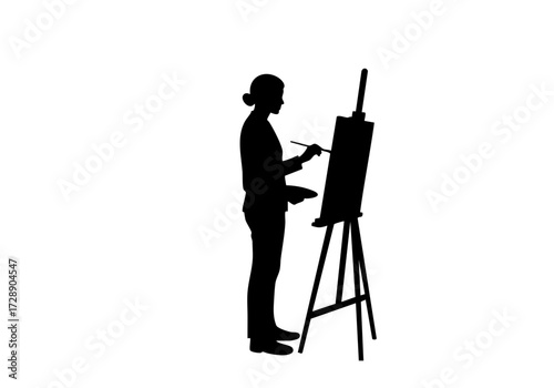 A silhouette of an artist at work, engaged in painting on a canvas.