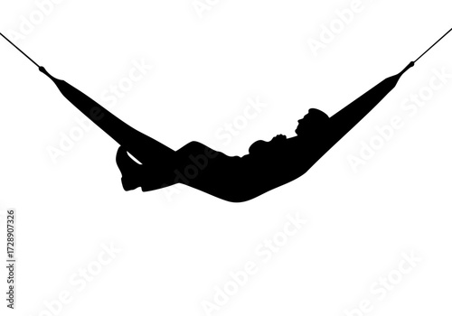 A silhouette of a person enjoying relaxation in a hammock.