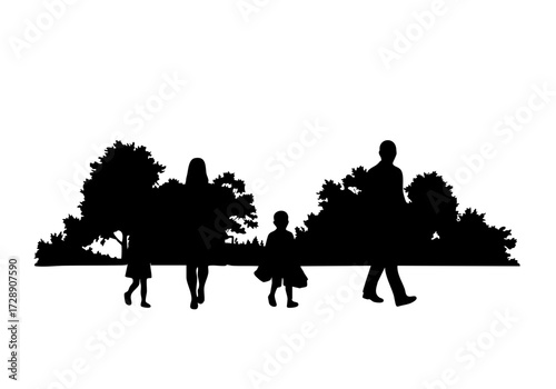 A family leisurely strolls through a serene park, their silhouettes creating a peaceful scene.