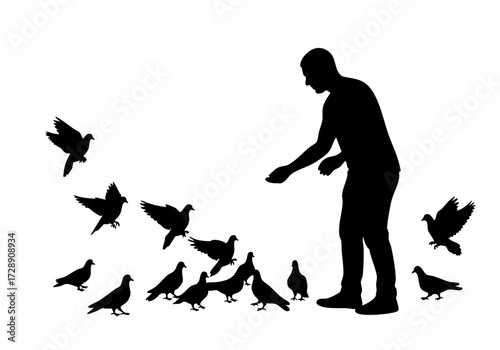 A silhouette of a person feeding birds.