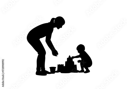 A mother and child build a sandcastle together at the beach.