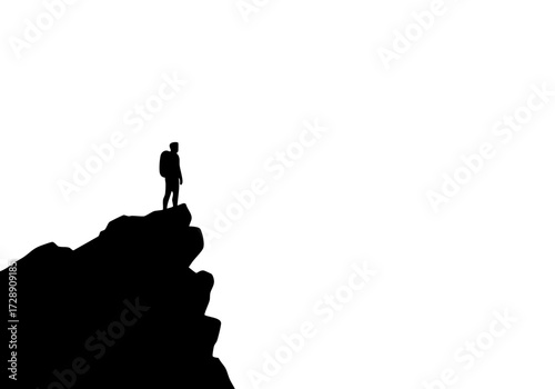 A lone hiker standing triumphantly on a mountain edge, a symbol of ambition and overcoming challenges. 