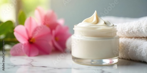 A jar of rich, creamy, luxurious moisturizer sits on a marble countertop next to blooming flowers and a soft, fluffy towel Perfect for skincare and beauty product marketing , skincare, ingredient