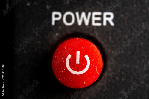 Tv red power on and off icon and button close up of a old black Television remote controller