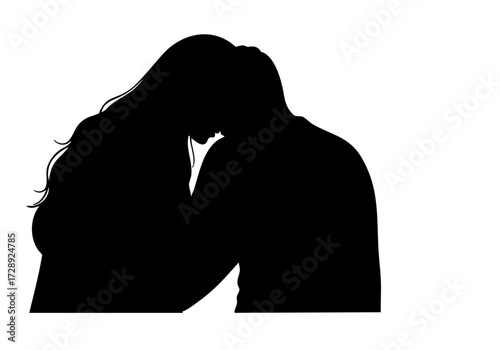 A romantic silhouette of a couple embracing and sharing a tender moment.