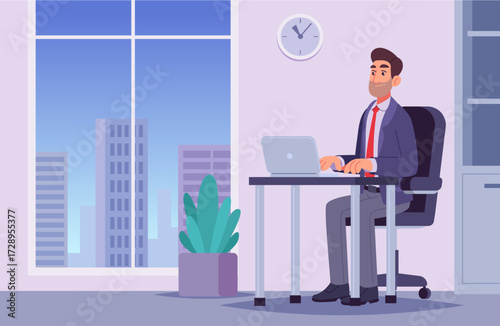 Businessman working on laptop in modern office