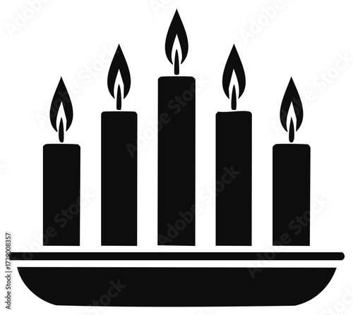 Silhouette of lit candles in a row, flame illuminated, for celebration