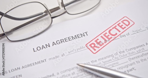Loan Application Rejected with Red Stamp on Financial Agreement