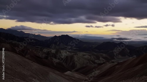 Cinematic Timelapse of Clouds Rolling Over Desert Mountains at Golden Sunset