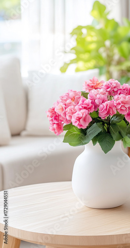 Wallpaper Mural A beautiful vase of pink flowers placed on a wooden table, adding a touch of elegance to the bright living space Torontodigital.ca