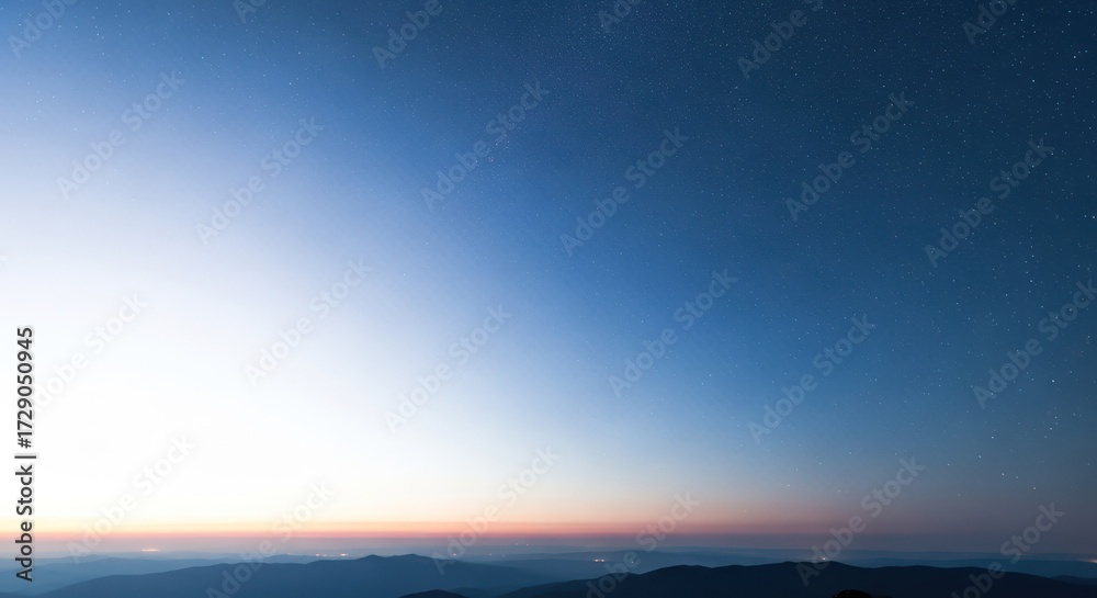 Fototapeta premium Night view of mountains under starry sky with soft light gradient