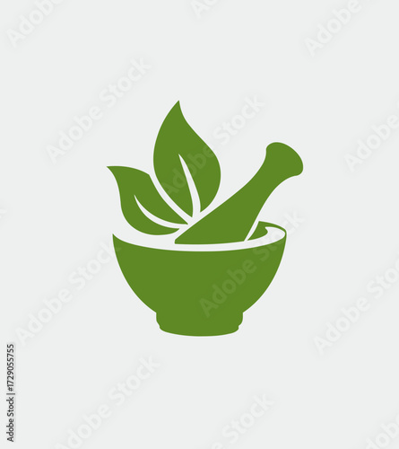 Herbal Remedy Green mortar and pestle with plant leaves on a solid white background