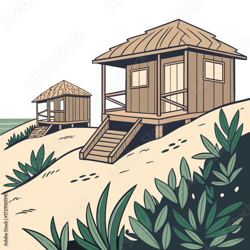 Two rustic wooden bungalows with thatched roofs perched on a sandy dune overlooking the ocean