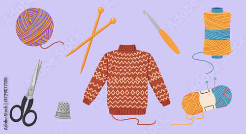 Knitting and sewing supplies surrounding a Fair Isle patterned sweater