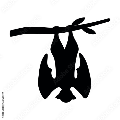 Silhouette of a bat hanging upside down from a tree branch