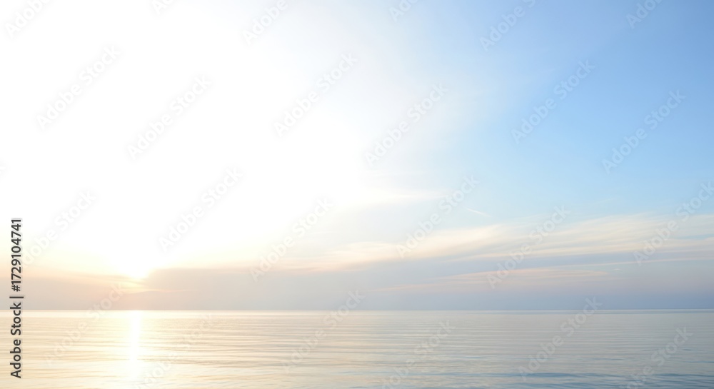 Fototapeta premium Calm ocean scene with pastel blue sky at golden sunrise or sunset