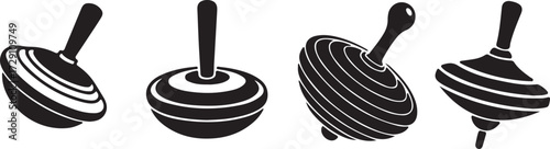 Four black and white silhouettes of spinning tops.