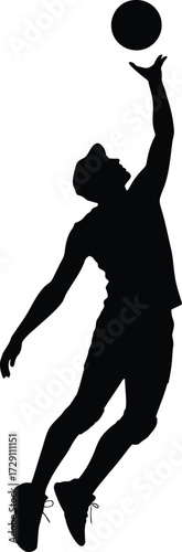 Black silhouette of athlete spiking volleyball player