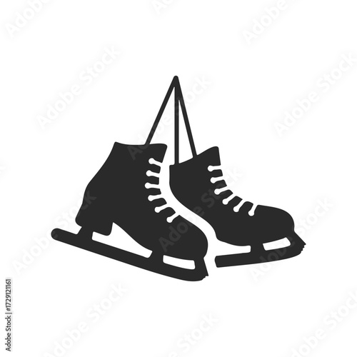Black silhouette of hanging ice skates on white background