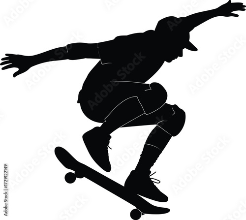 Skateboarder performing aerial trick silhouette action