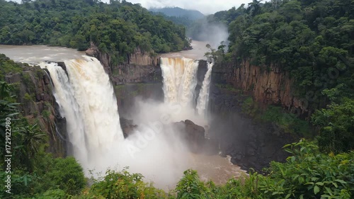 Kaieteur Falls, Guyana Kaieteur Falls framed by misty jungle and dramatic cliffs, sunlight breaking through clouds, cinematic ultra-realistic photo 
