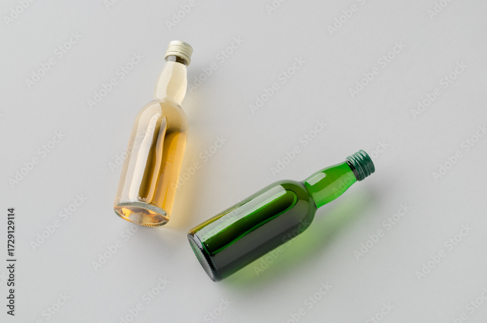 Naklejka premium Miniature spirits, liquor bottle mockup