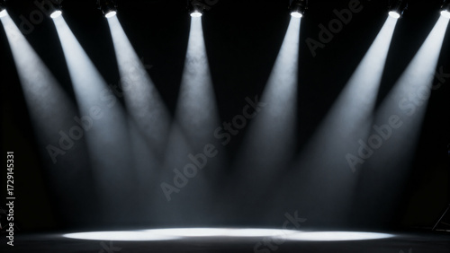 Spotlights shining on dark stage