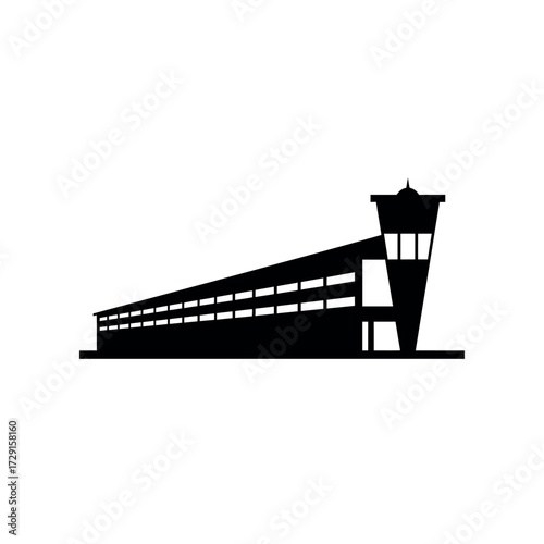 Silhouette of a Modernist Airport Terminal Building with Tower.
