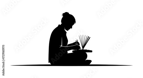 Focused artisan meticulously crafting delicate paper art with artistic precision and creative passion