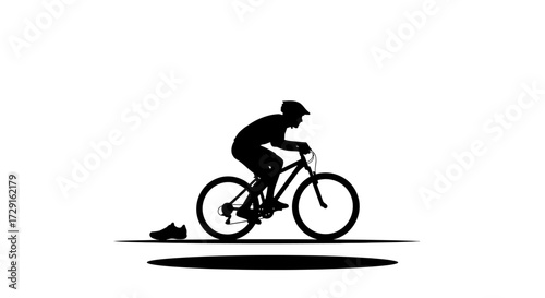 Dynamic cyclist in silhouette conquers challenging terrain with intense focus and athletic spirit