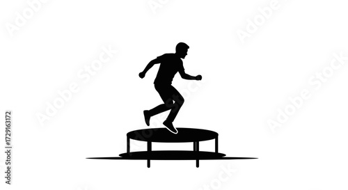 Dynamic silhouette of a man energetically jumping on a trampoline, capturing fun and active motion.