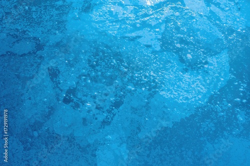 Wallpaper Mural A stone barrier guarding a historic hall with an abstract winter landscape featuring water, ice, and blue light textures Torontodigital.ca