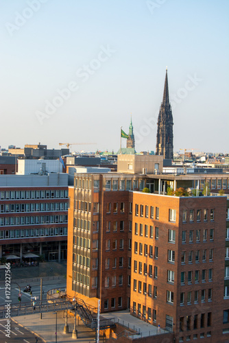 City skyline with historic church spire and modern buildings