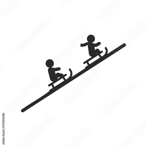 Sledding fun: silhouettes on a winter slope with two kids on sleds