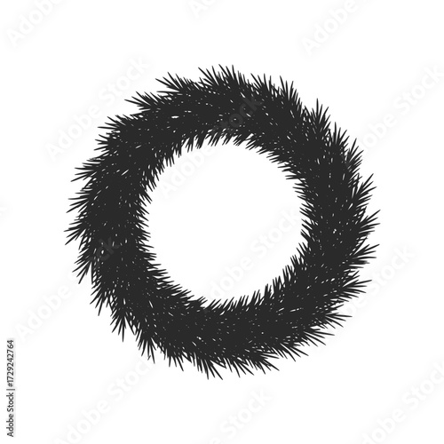 Black circular winter wreath with pine needles on white background