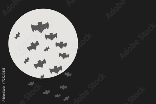 Cloud of bats flying in front of the moon with copy space