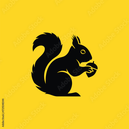 Black silhouette of a squirrel holding an acorn on a bright yellow background