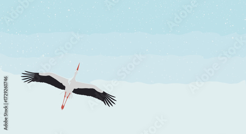 A majestic white stork soars gracefully through the winter sky with its wings outstretched and visible snow falling gently around it.