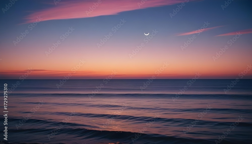 Fototapeta premium Sunset over the ocean with a crescent moon in the sky