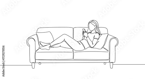 Young woman relaxing on sofa while using smartphone at home  