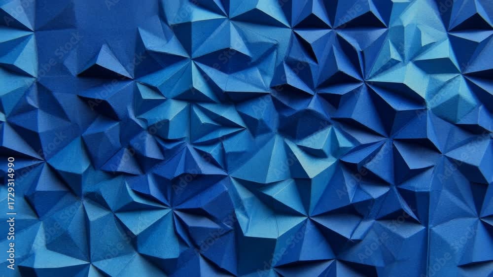 Abstract blue geometric texture made of folded paper, origami-style, viewed on a flat background, symbolizing creativity and precision