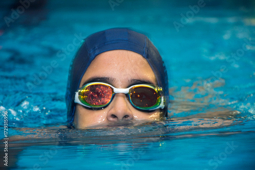 Close-up view of little swimmer in pool