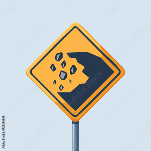 Yellow diamond shaped road sign warning of falling rocks.