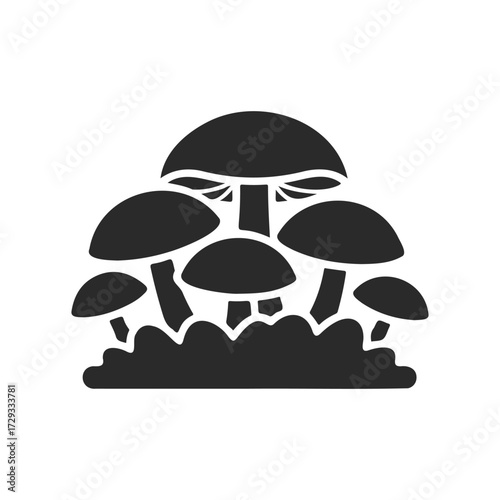 Black silhouette of mushroom cluster growing on forest ground