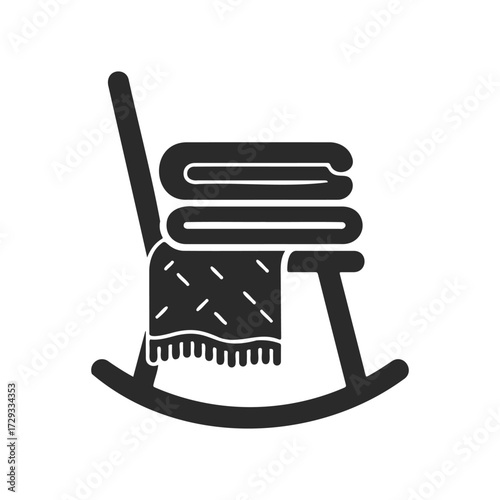 Rocking chair silhouette with folded blanket and quilt on white background