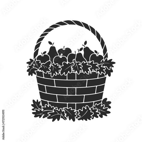 Apple and pear harvest basket filled with autumn leaves