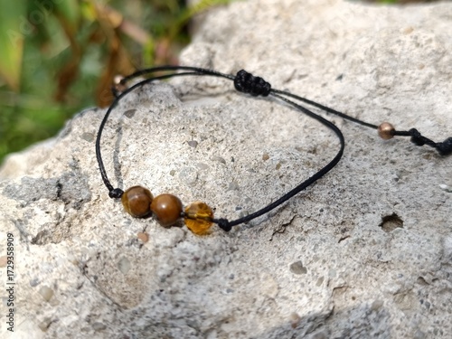 Bracelet with three natural stones. Amulet bracelet with a black thread.