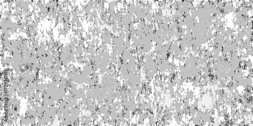 Abstract monochromatic textured background with a mottled pattern of light and dark gray and white speckles